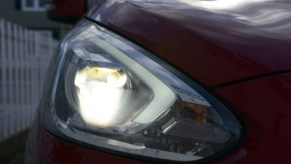 A dull looking headlights of a mitsubishi mirage