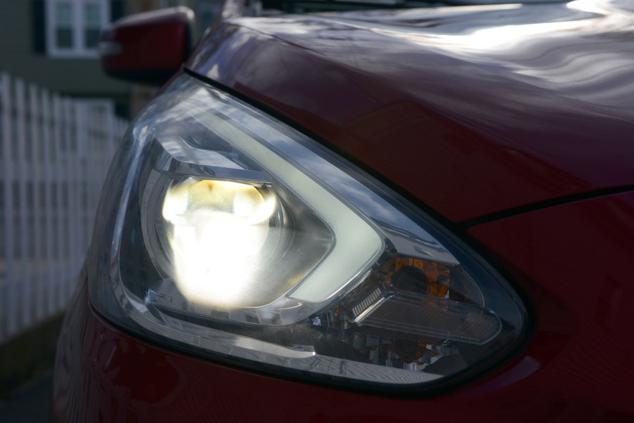 A dull looking headlights of a mitsubishi mirage