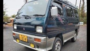 a green Mitsubishi Bravo microvan