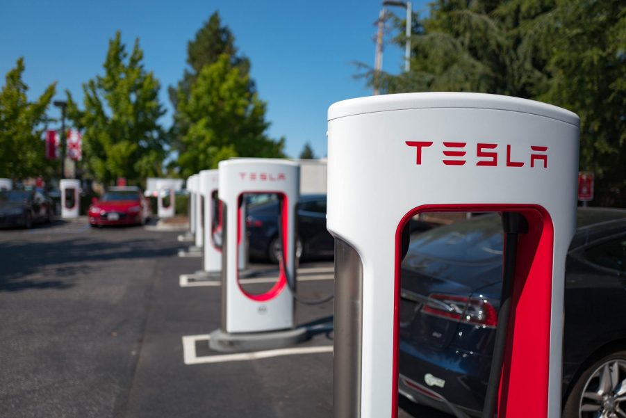 a row of Tesla chargers is great but there arnet enough in America yet to warrant buying your first EV.