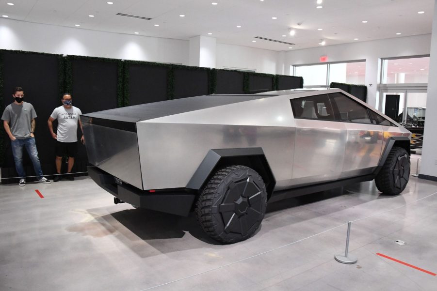 A steele Tesla Cybertruck electric pickup on display indoors