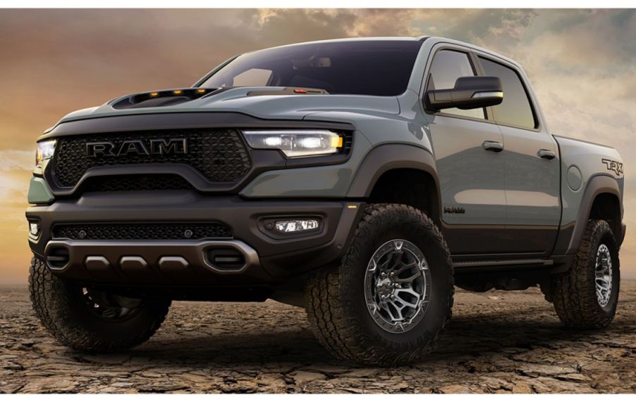 2021 Ram 1500 TRX is parked on gravel with a wide aggressive stance