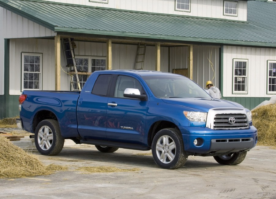 A blue 2007 Toyota Tundra by a farmhouse