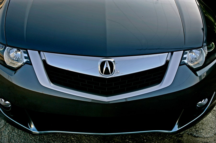 A closeup of the grille, headlights, and front bumper of a black 2008 Acura TSX luxury sedan in Los Angeles in April 2008