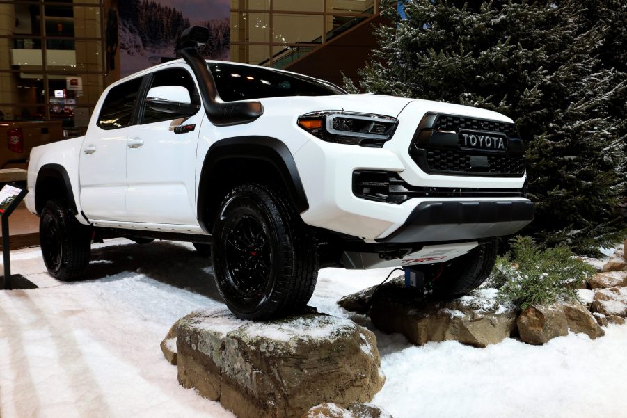 A white 2019 Toyota Tacoma Pickup Truck, Kelly Blue Book 5-year Cost of Ownership Award winner