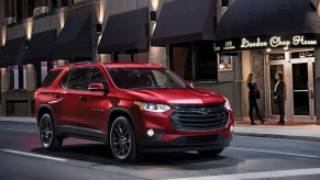 A red 2021 Chevy Traverse parked at a traffic light