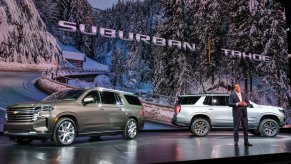 General Motors President Mark Reuss introduces the 2021 Chevy Suburban (left) and Chevy Tahoe on December 10, 2019, in Detroit, Michigan