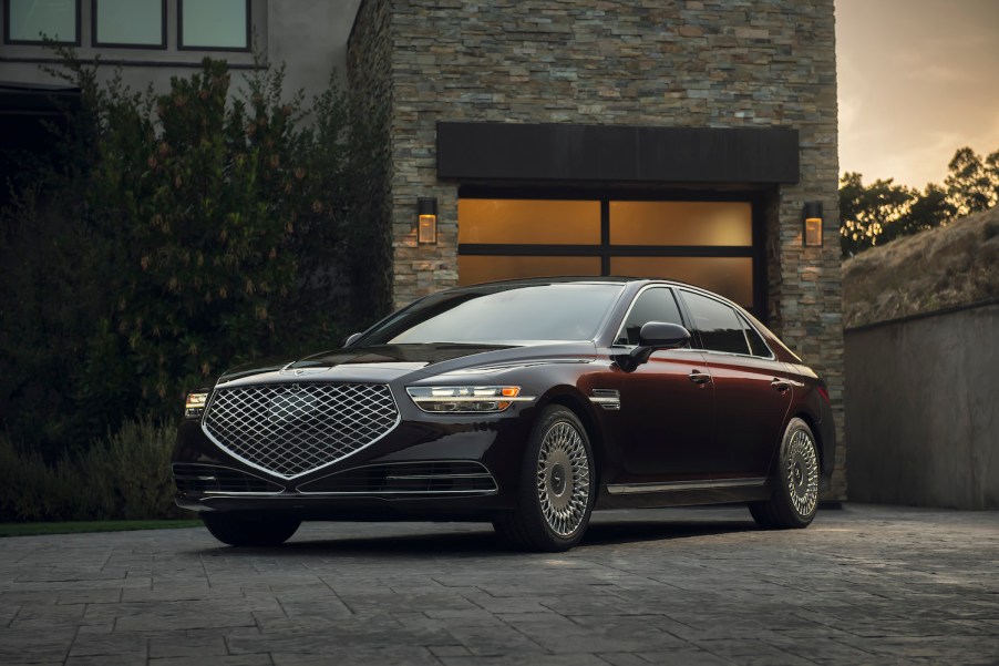 A maroon 2021 Genesis G90 parked, the G90 is one of the best luxury cars for tall drivers