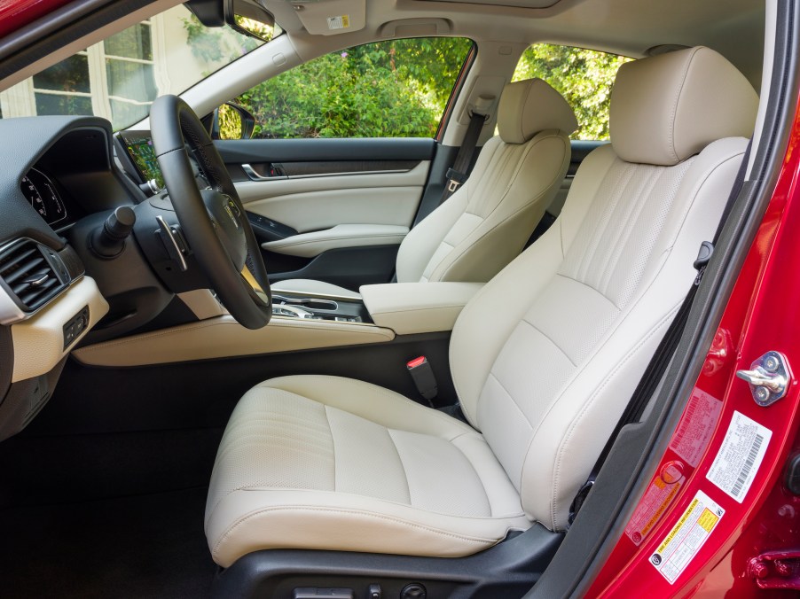 The white-leather front seats of a 2021 Honda Accord Hybrid