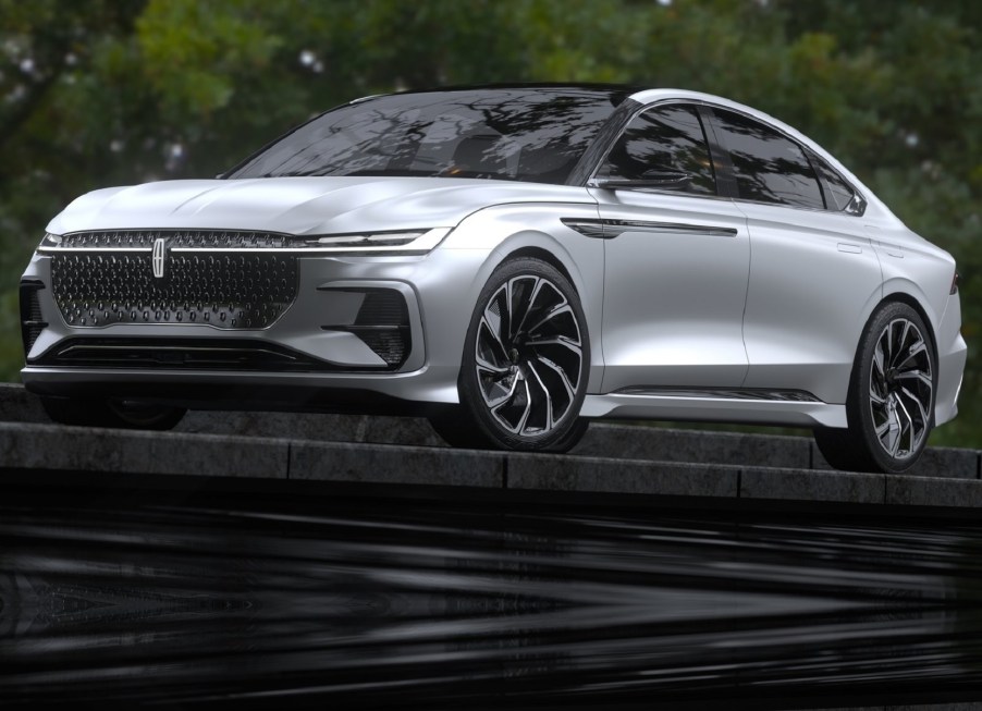 The silver 2021 Lincoln Zephyr Reflection Concept parked on top of a flight of black stone steps