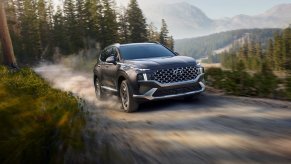 The 2022 Hyundai Santa Fe PHEV driving down a dirt road