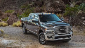 A black 2021 Ram 2500 parked on a gravel road