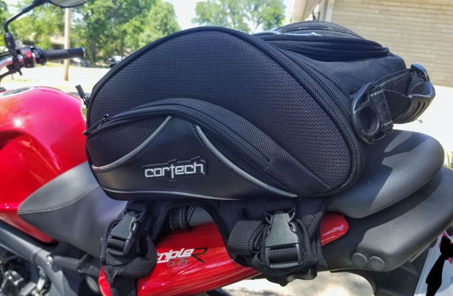 A black Cortech Super 2.0 Tail Bag on a red 2012 Triumph Street Triple R