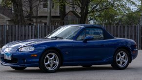 A blue 1999 Mazda MX-5 Miata 10th Anniversary Edition in a parking lot