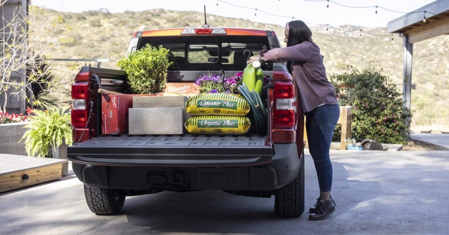 loading the Ford Maverick pickup bed full of landscaping supplies