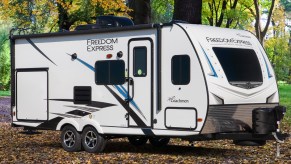 Coachmen RV trailer in a press photo in the forest