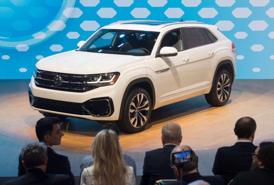 a white 2020 Volkswagen Atlas on display at an auto show