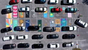 An image of several vehicles parked on their own separate parking spot.