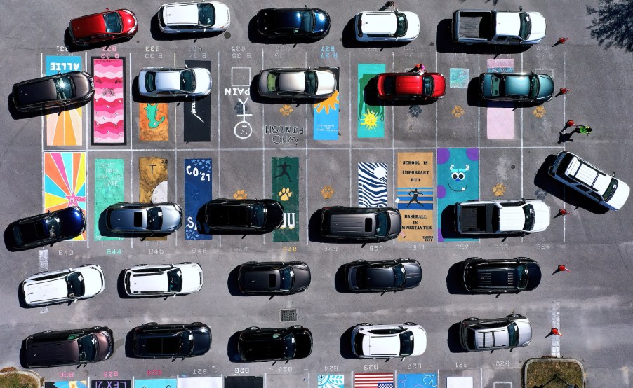 An image of several vehicles parked on their own separate parking spot.