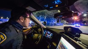 A police officer watching traffic in the city