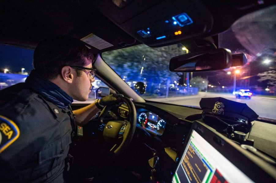 A police officer watching traffic in the city