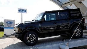 A black 2021 Ford Bronco on a dealership lot