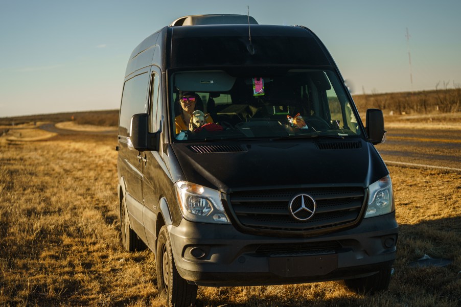 a black Mercedes-Benz Sprinter camper van conversion