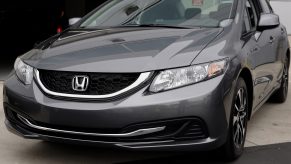 A grey Honda Civic parked streetside