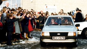 An image of Princess Diana driving her Ford Escort.