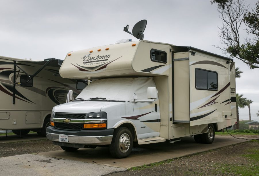 a Chevy Coachmen freelander parked at an rv park