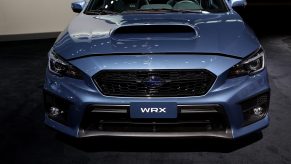 A silver Subaru Impreza WRX at an auto show