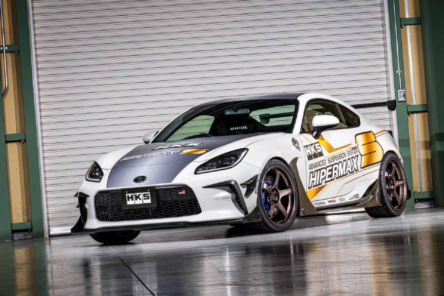 The white-and-gold HKS Toyota GR 86 Concept in a garage