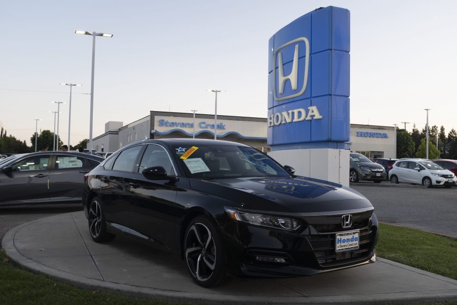 Honda logo and black Honda Accord vehicle are seen at a store in San Jose, California on August 27, 2019.