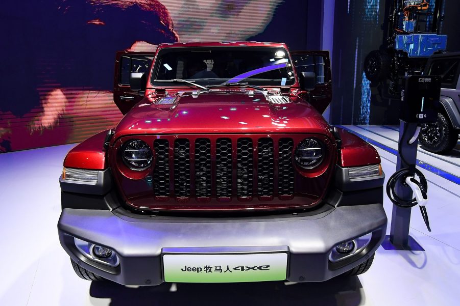 A red Jeep Motor Wrangler 4xe car is on displayed during the 19th Shanghai International Automobile Industry Exhibition