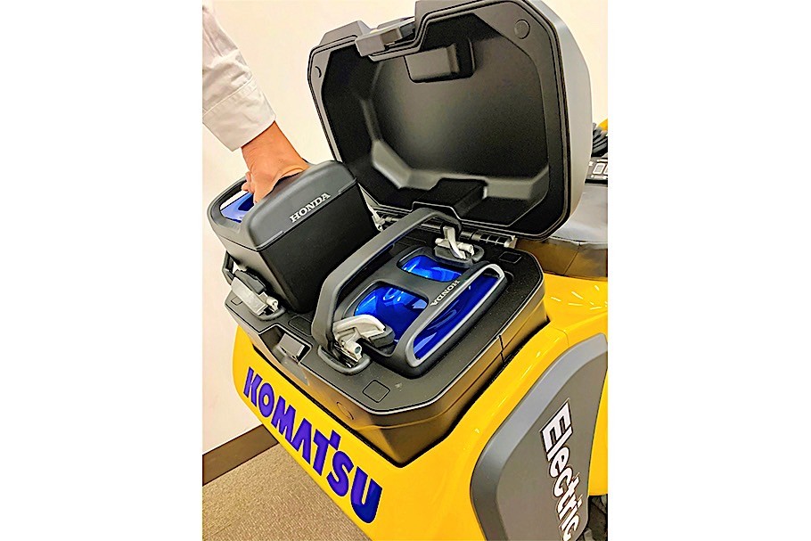 Komatsu electric excavator showing the Honda battery pack 