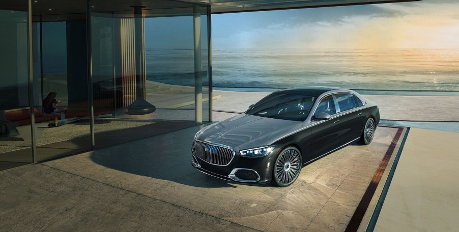 A Mercedes-Maybach parked outside of a beachfront home.