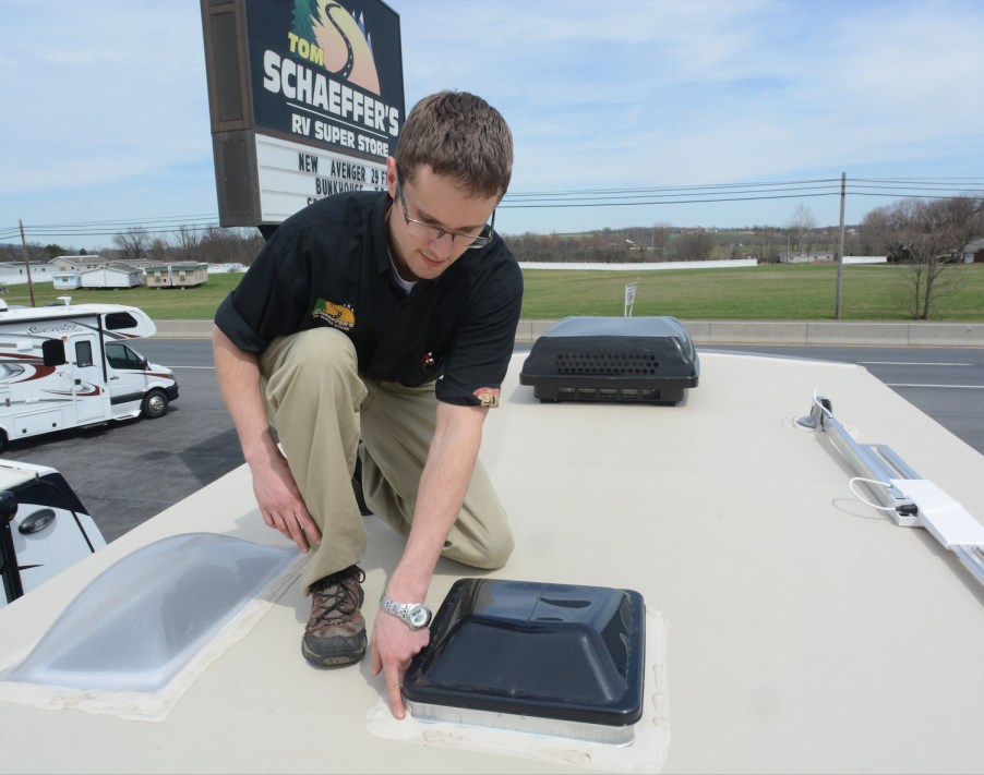 Checking RV Maintenance at Tom Schaeffer's RV Super Store, in Shoemakersville, with Aaron Bashore, service advisor. Check seals on roof vents and sky lights.