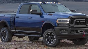 A blue 2021 Ram Power Wagon parked on dirt and gravel.