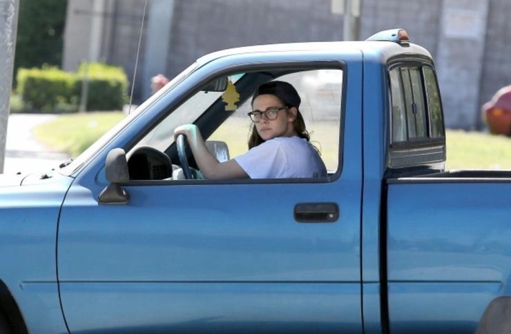 a blue single cab Toyota T100 with Kristen Stewart in the drivers seat