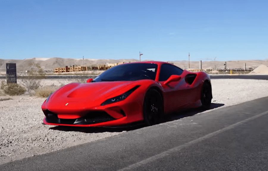 An image of a broken Ferrari F8 Tributo on the side of the road.