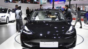 A black Tesla Model 3 car is on displayed during the 19th Shanghai International Automobile Industry Exhibition