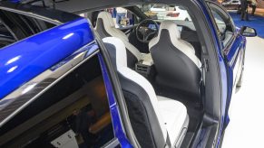 Open Falcon wing doors on a Tesla Model X 90D full electric luxury crossover SUV car on display at Brussels Expo