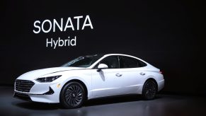 Hyundai shows off their white 2020 Hyundai Sonata Hybrid at the Chicago Auto Show