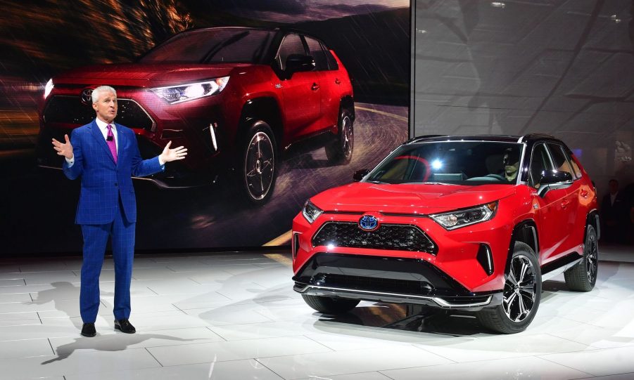 Toyota North America's Jack Hollis, group Vice president and general manager, introduces the red 2021 Toyota RAV4 Prime at the 2019 Los Angeles Auto Show