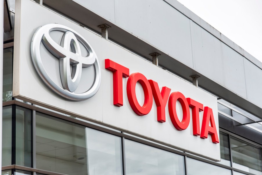 The Toyota logo seen on a car dealership