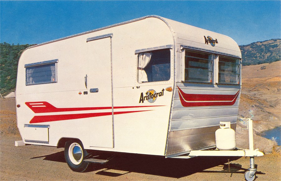 A vintage photo of a small Aristocrat travel trailer in the 1960s. This is not the camper that Lauren Nelson renovated.