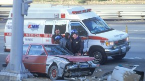 A highway patrolman at a car carsh in California