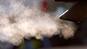 Exhaust billows out of a car tailpipe on January 2, 2008, in San Francisco, California