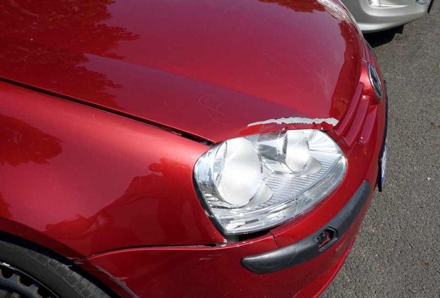 Damaged paint on a vehicle that will need to be repainted