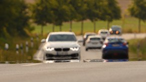 Heat shimmer can be seen on a road busy with cars